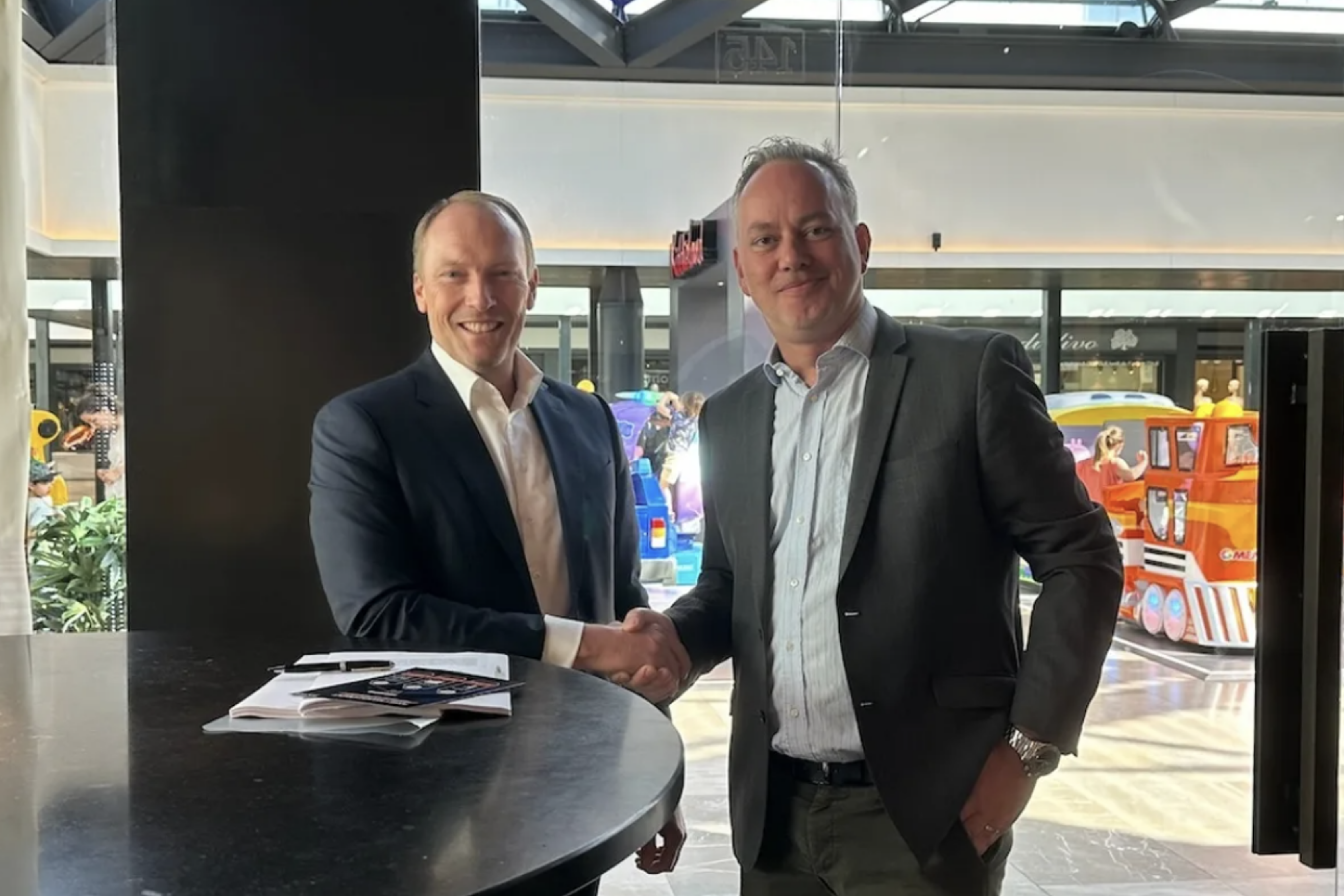 CEO at aXite Security Tools and Co-founder & CEO at DTACT shaking hands