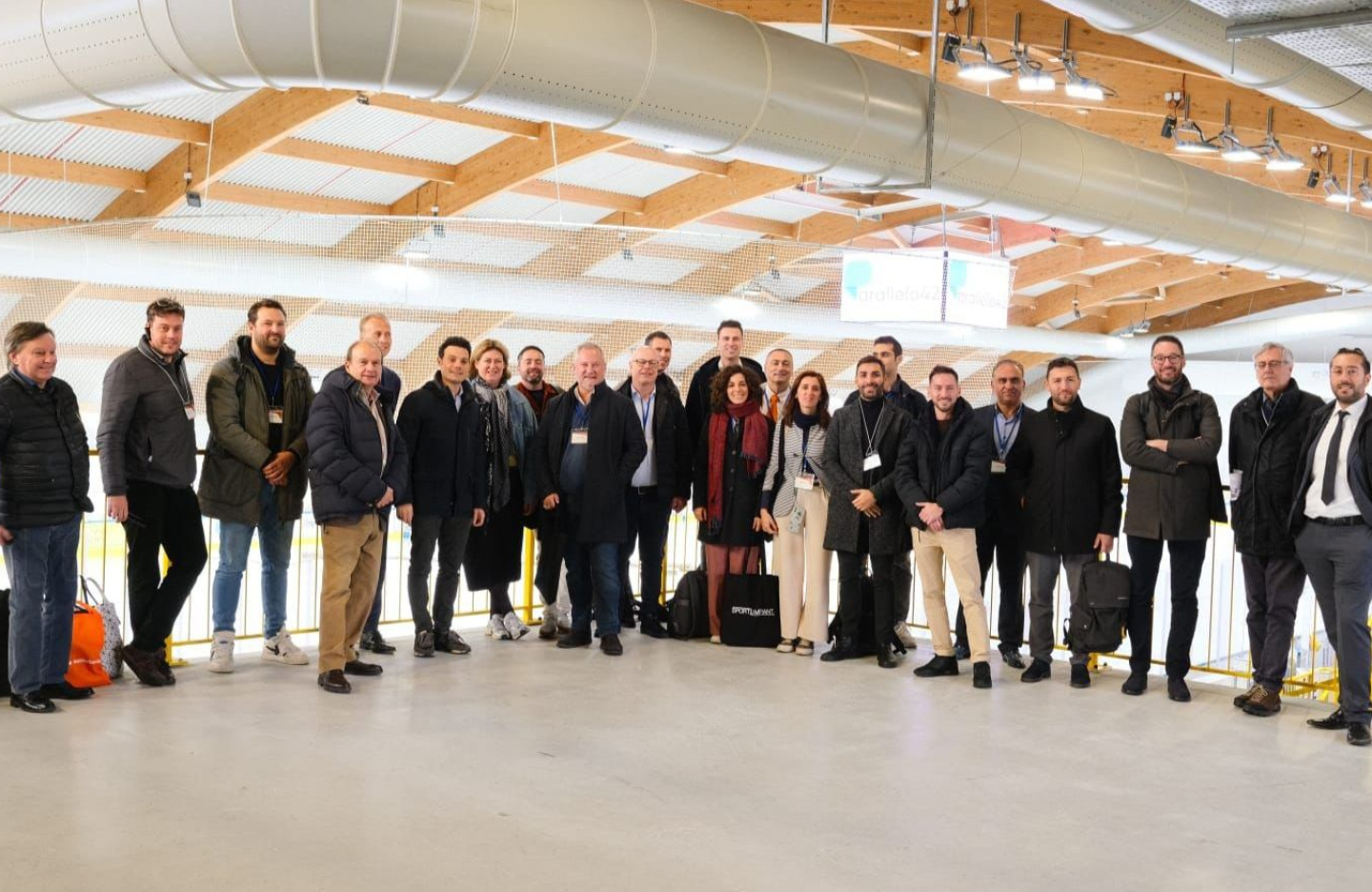 a delegation poses for a group image while on a trade mission to Italy