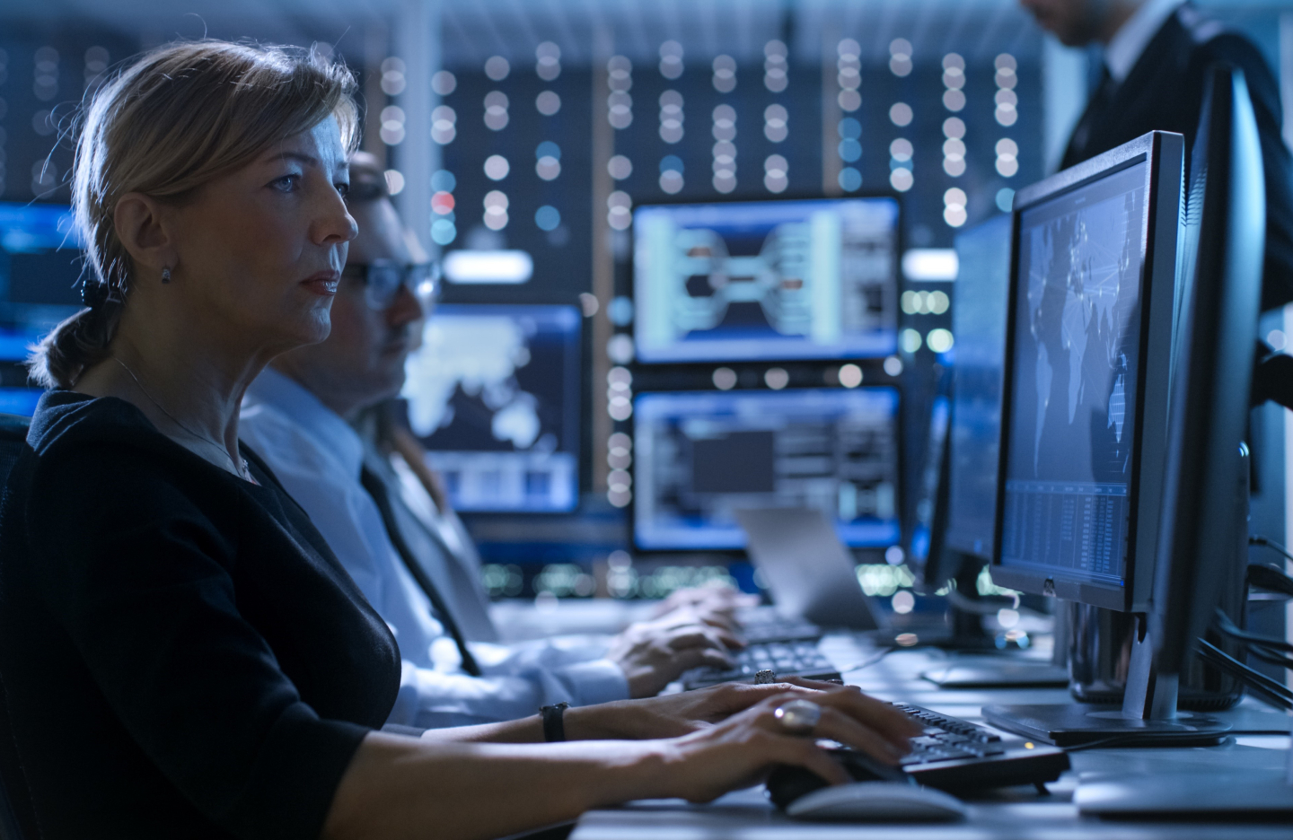 Woman behind computer screen