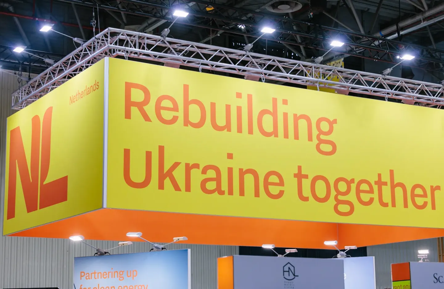 The sign for ReBuild Ukraine at the NL Pavilion which says 'Rebuilding Ukraine together'