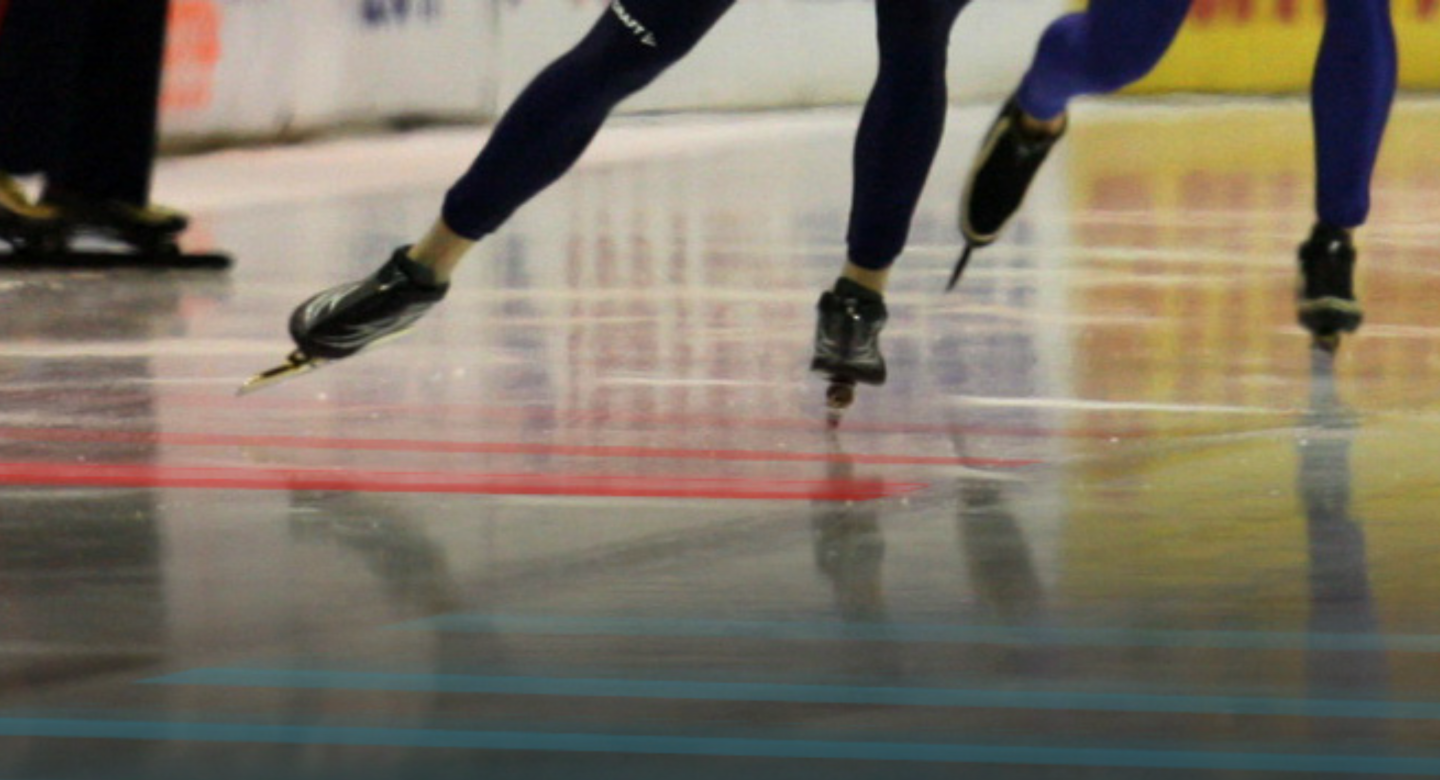 ice skaters legs close up on a rink