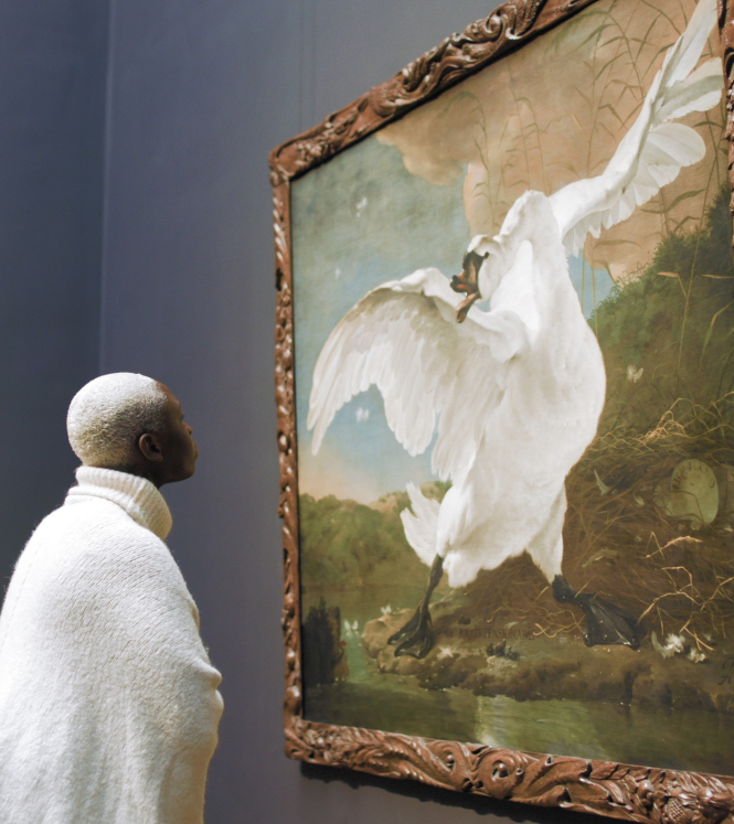 Person looking at painting in museum