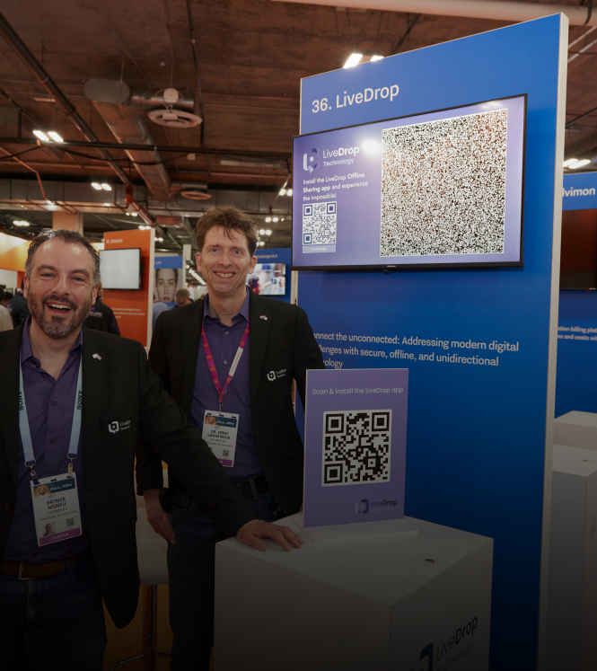 Cofounders of LiveDrop at their stand at CES 2024