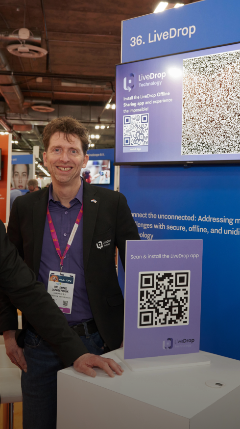 Cofounders of LiveDrop at their stand at CES 2024