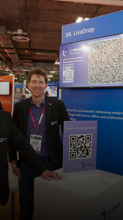 Cofounders of LiveDrop at their stand at CES 2024