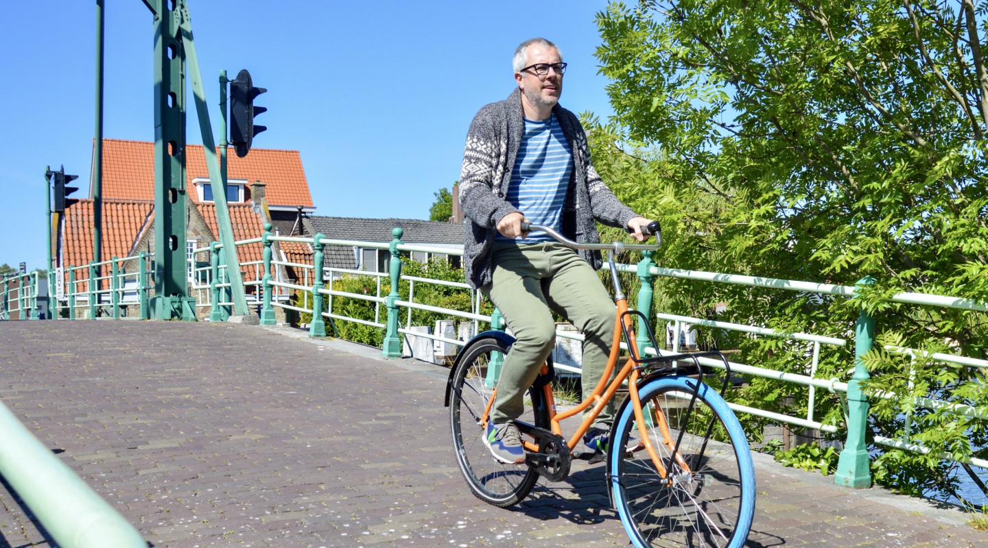 Chris biking on a sunny day in the Netherlands