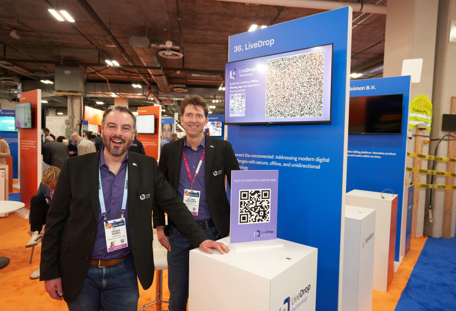 LiveDrop cofounders Patrick Moreu (left) and Erno Langendijk (right) standing at company stand at CES 2024