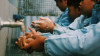 Children learning to wash their hands